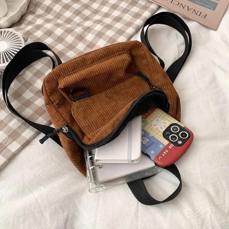 Ladies fashion canvas small square backpack random colours.