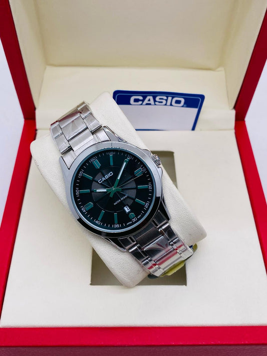 Casio stainless steel men’s watch with green dial and date display