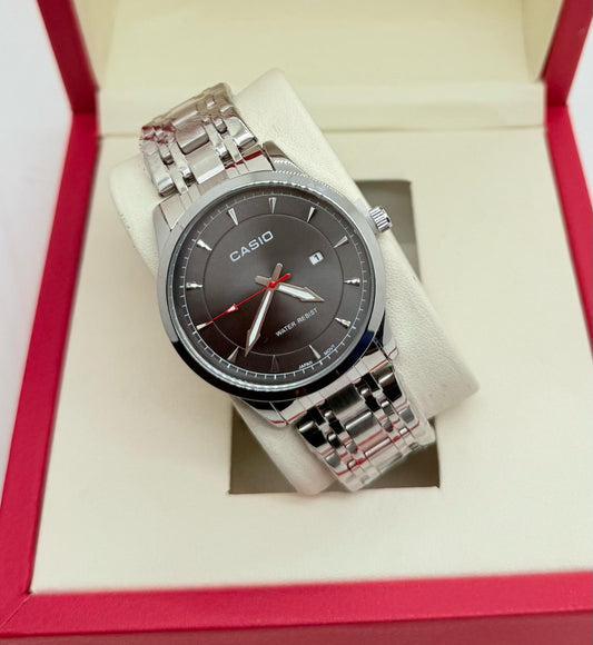 Casio men’s silver watch with black dial and stainless steel strap
