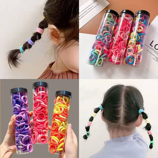 100 colorful elastic hair ties for kids in a transparent jar, used for braids and ponytails