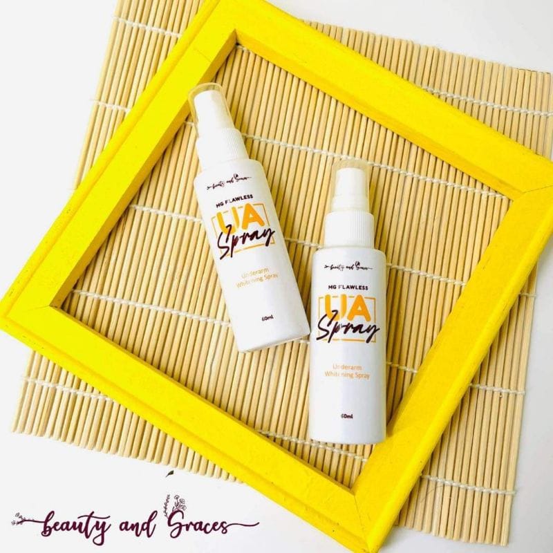 White spray bottle of Ms. Flawless UA Spray with orange text on yellow background.