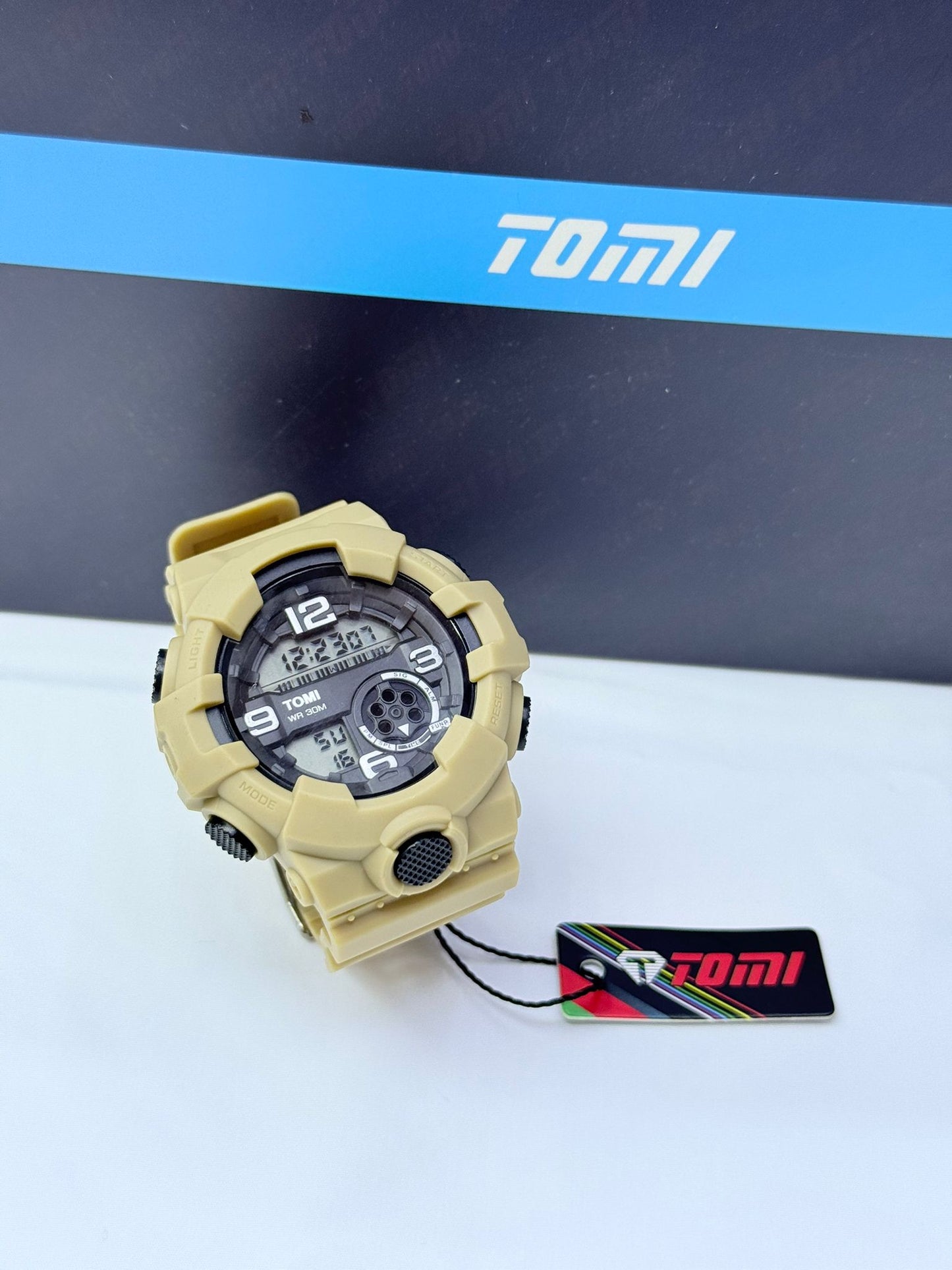 Desert beige Tomi digital analog sports wristwatch with rugged military-style design.