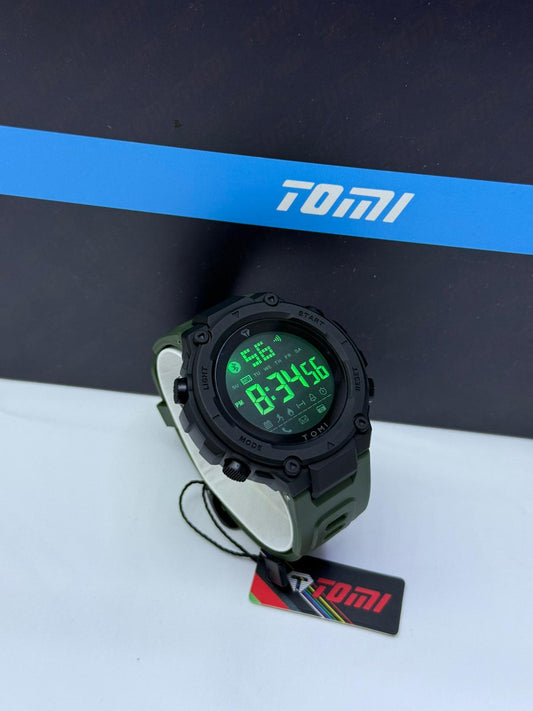 Tomi full digital sports watch with black case, army green strap, and green LED display.