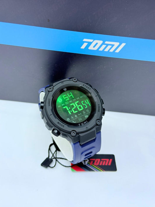 Tomi full digital sports watch with black case, navy blue strap, and green LED display.