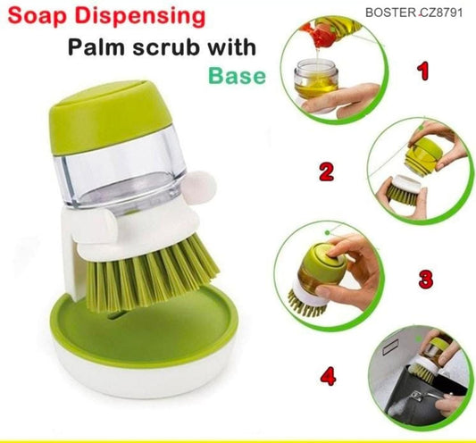 Soap dispensing palm scrub brush with green base for kitchen dishwashing and sink cleaning.